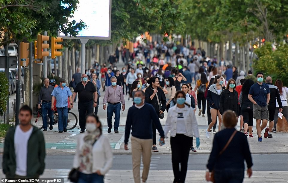 SPAIN: People walk on a street in L