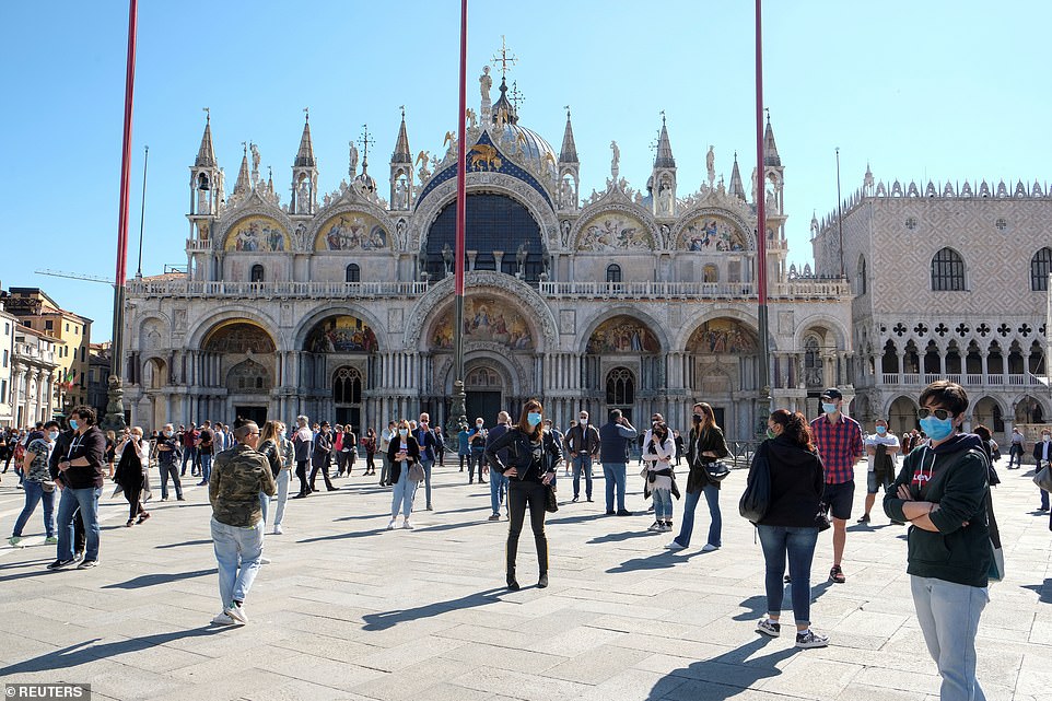 ITALY: People gather in front of St Mark