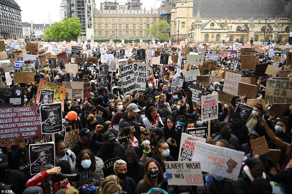 Vast crowds were seen in Parliament Square with demonstrators - mostly wearing protective face masks - clutching placards