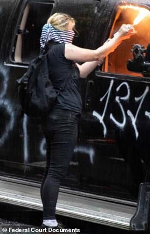 Margaret Aislinn Channon (left and right), 25, was arrested by federal authorities wearing full SWAT gear from her home in Tacoma after being caught setting fires in the vehicles (left) by multiple cameras at the end of May