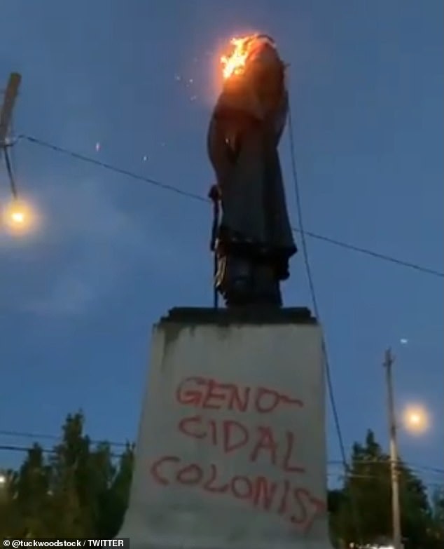 A statue of George Washington with a burning American flag draped across it was toppled by protesters in Portland, Oregon on Thursday night