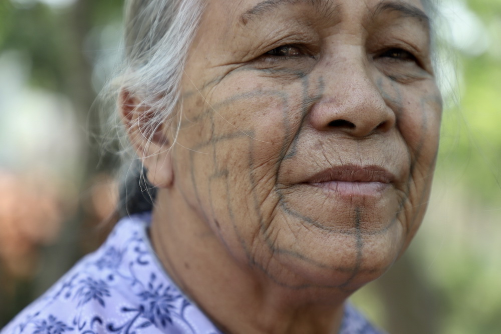tattooed face woman