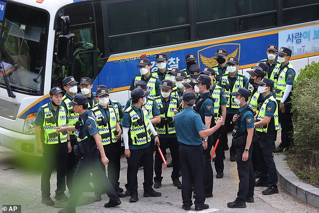 Officers arrive to search for Park Won-soon, whose concerned daughter reported him missing to police earlier today and said her father