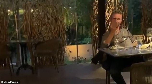 The mother of a British tech CEO who was filmed hurling vicious racist abuse at an Asian family says she is 