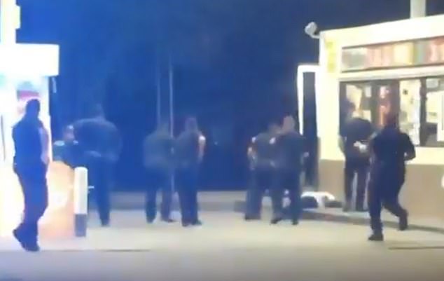 The immediate aftermath of the shooting is seen, after police fired 11 rounds