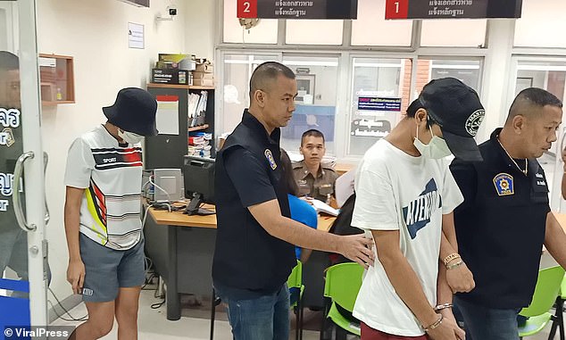 Boyfriend Jay, pictured front in white at the police station, who was not the baby