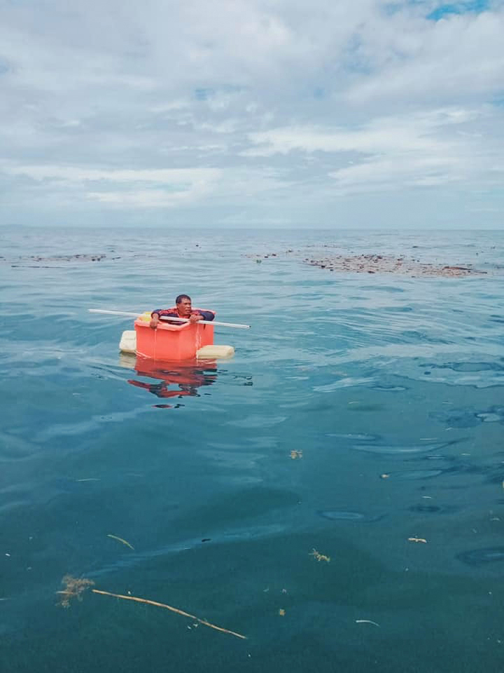 The fisherman had to make-do with the orange box after his boat toppled and capsized