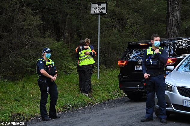 Distraught rescuers console each other after William Wall