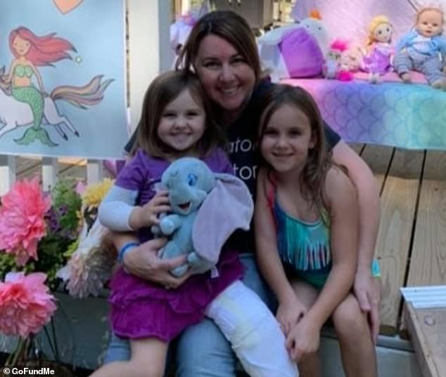 Abigail Reardon (pictured with her sister and mother) was staying at her father