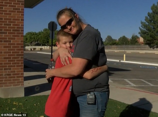 Jonathan, pictured with mother, Angel, having received the good news they now have internet