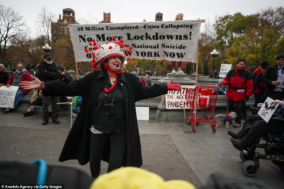 A protester speaks Sunday. Skyrocketing COVID-19 cases and hospitalizations have prompted state and city officials around the United States to issue new lockdown guidance
