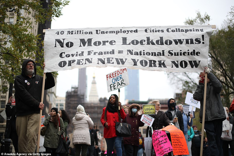 Protesters carried signs reading 