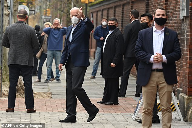 Joe Biden gave a thumbs-up as he walked out of a Philadelphia hospital after a follow-up exam on his foot which he fractured while playing with his pet dog Major
