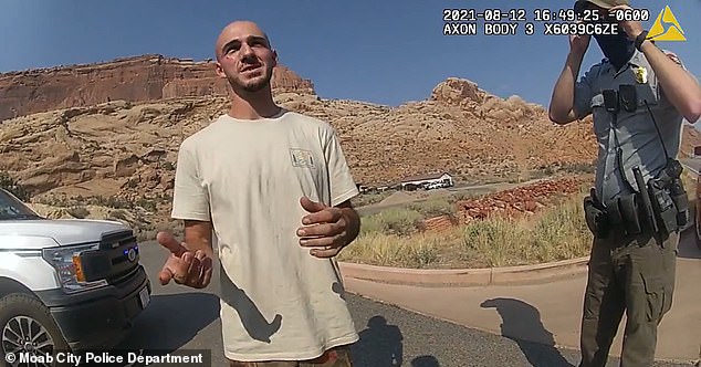 Laundrie is seen in police bodycam with scratches on his face which he tells an officer were caused when Petito