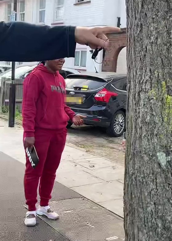Another car has a parking ticket placed on its rear window