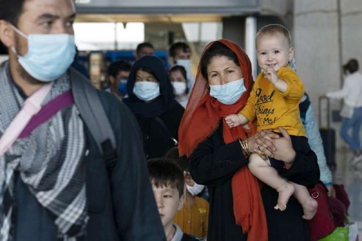 US resumes Afghan refugee flights after measles shots | World News – India TV