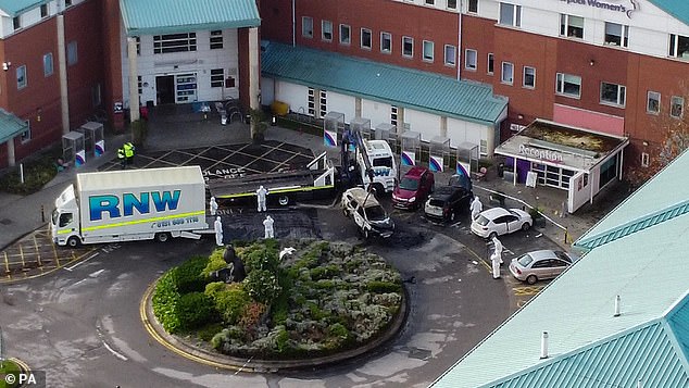 This afternoon the damaged taxi was being removed by forensic officer after the explosion at the Liverpool Women
