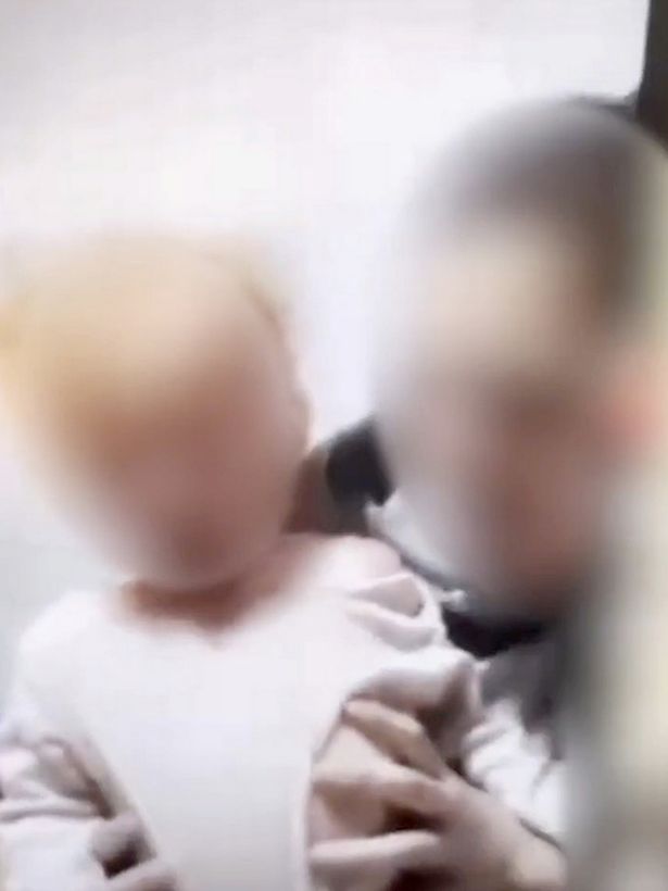 In the distressing clip, the child is seen coughing and spluttering