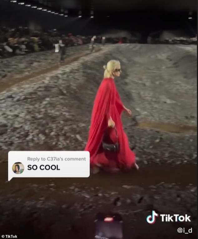 The Paris Fashion Week show saw models trudging through mud wearing clothes costing thousands in a nod to