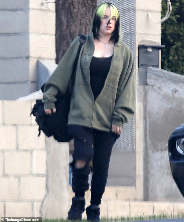 Billie Eilish is seen in a tank top as she hugs her brother Finneas | Daily Mail Online