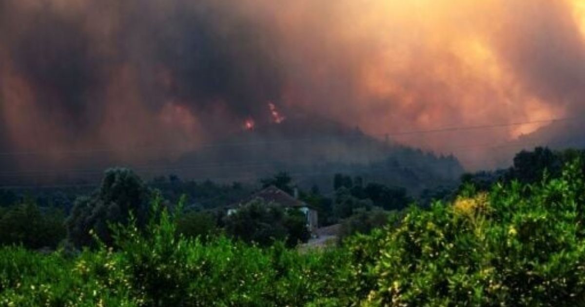 copy of articles thumbnail 1200 x 630 2025 07 01t144624 501.jpg - Rescuers Battle Wildfires As Popular Travel Hotspot's Skies Turn Black with 50,000 People Evacuated