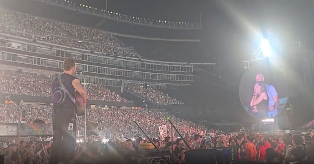 copy of articles thumbnail 1200 x 630 96 5.jpg - New video shows Chris Martin cringe at sight of embarrassed CEO caught cuddling HR boss during Coldplay concert
