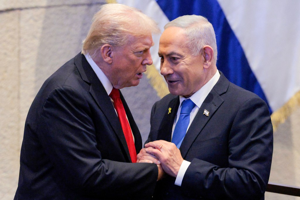 Donald Trump and Benjamin Netanyahu holding hands.